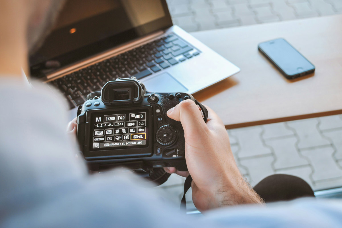 A student busy learning the basics of his camera in a beginner photography course in Pretoria.